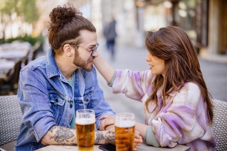 couple in conversation at cafe