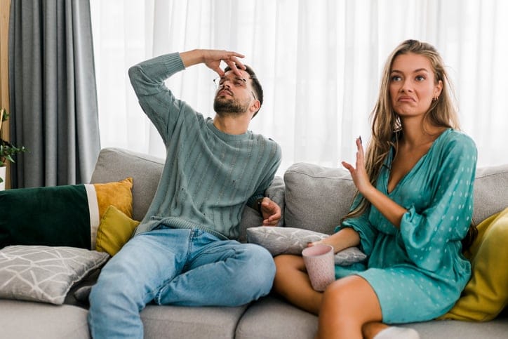 couple having argument on couch