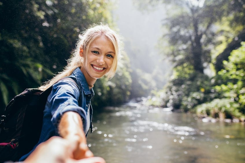happy woman hike forest waterfall