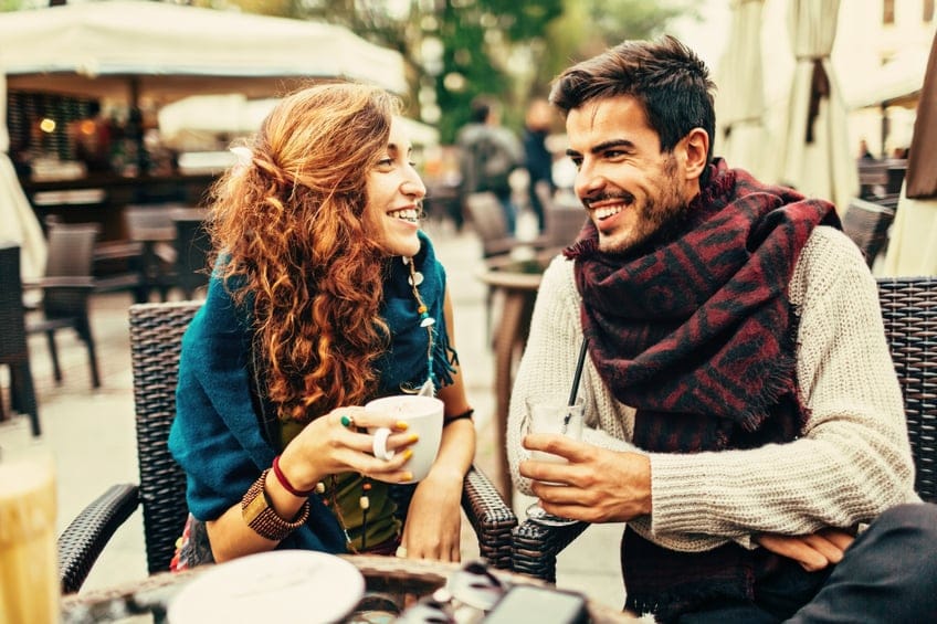 A happy couple enjoying the day at the cafe.
