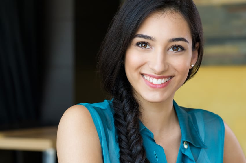 long haired brunette woman smiling