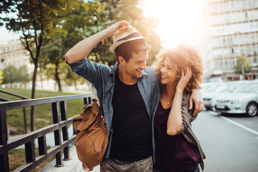 Close up of a happy young couple enjoying city life.