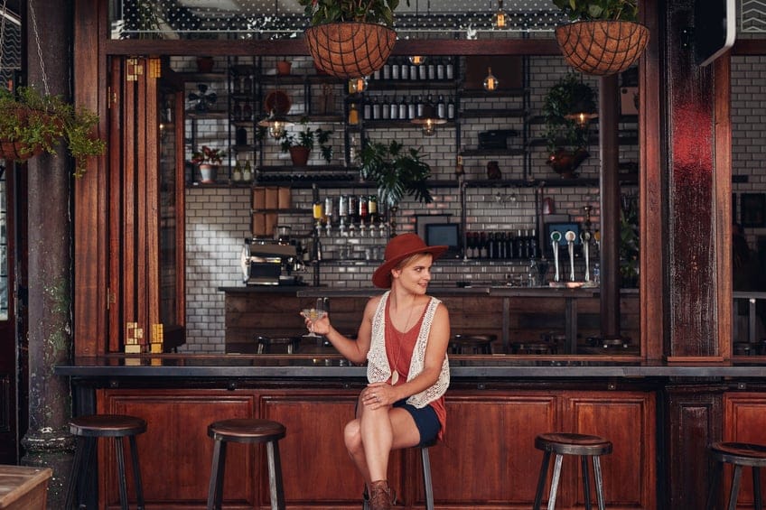woman alone single bar