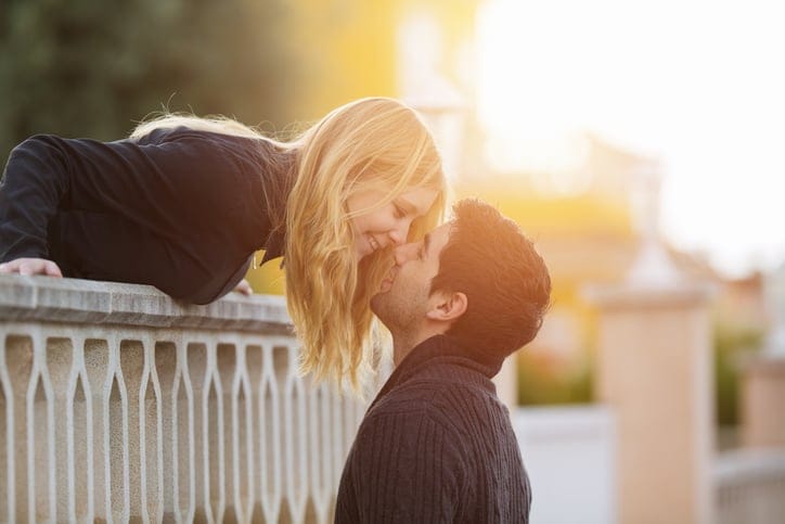 young couple at balcony in romance. Teenager in love