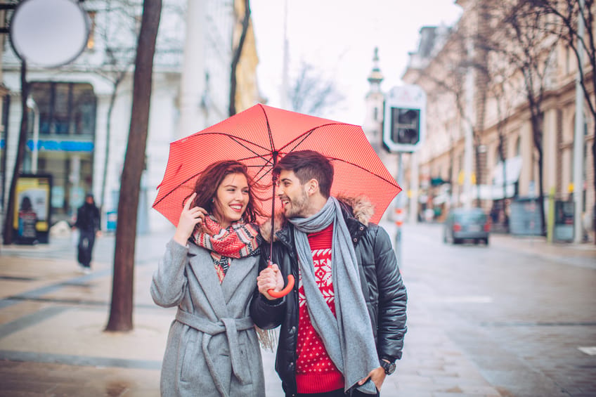 couple walking umbrella rain