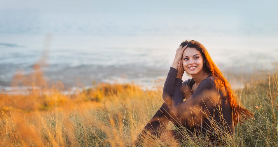 woman smiling beach portrait cold