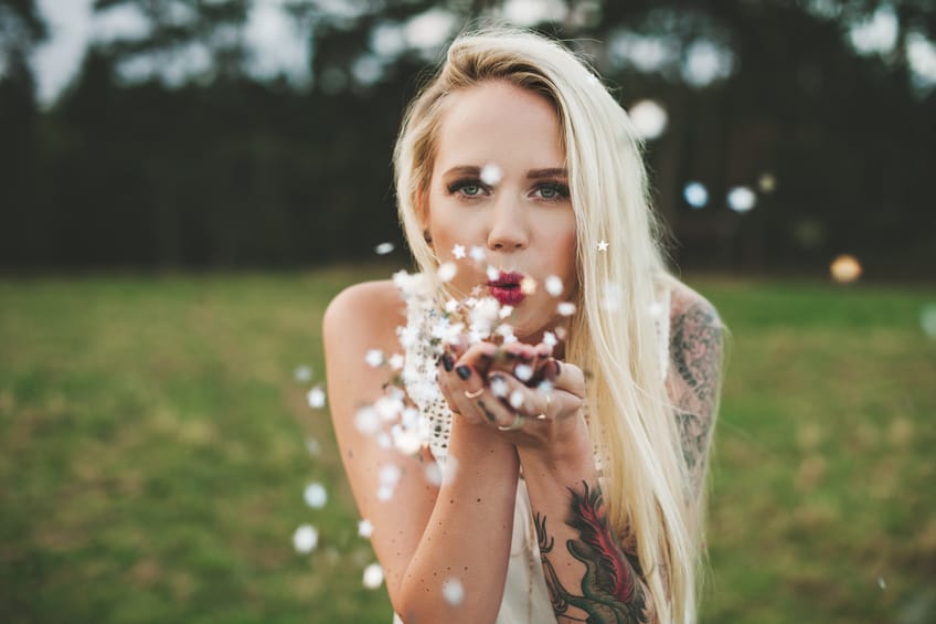 happy woman field flowers portrait