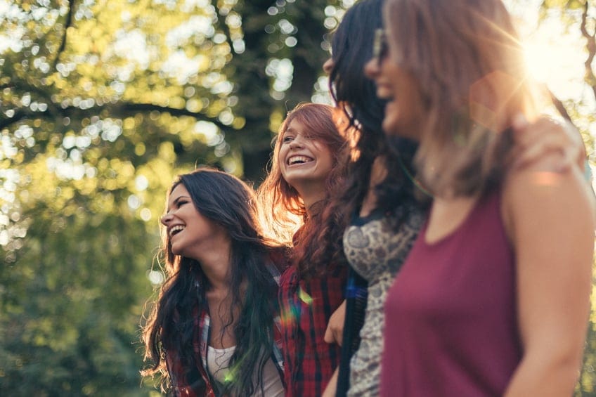 Group of teenage girls on a leisure walk in the city park