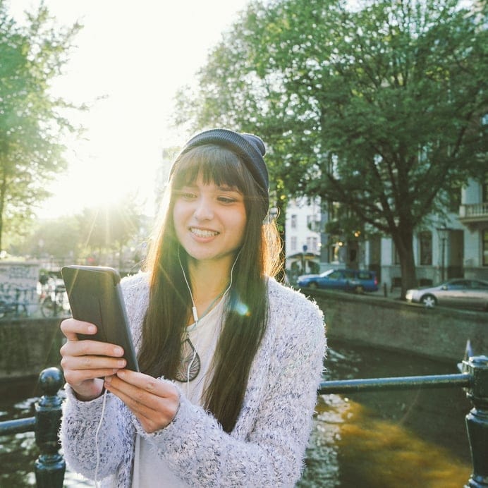 happy woman texting smiling