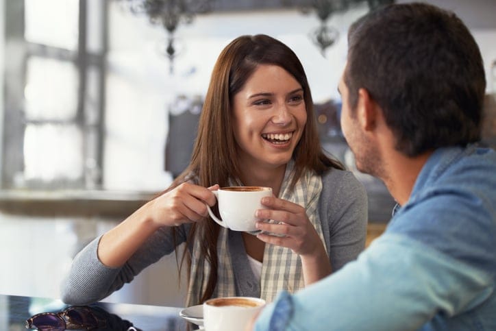 A loving young couple at a coffee shop together