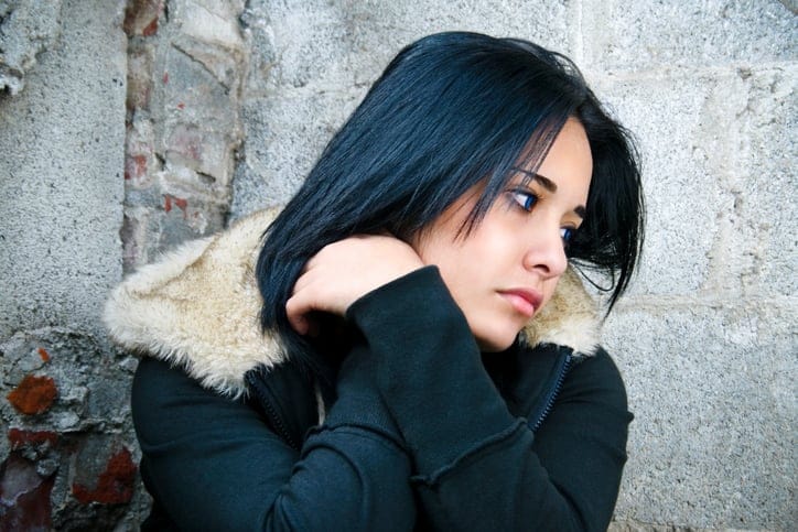 Young Latin girl day dreaming.