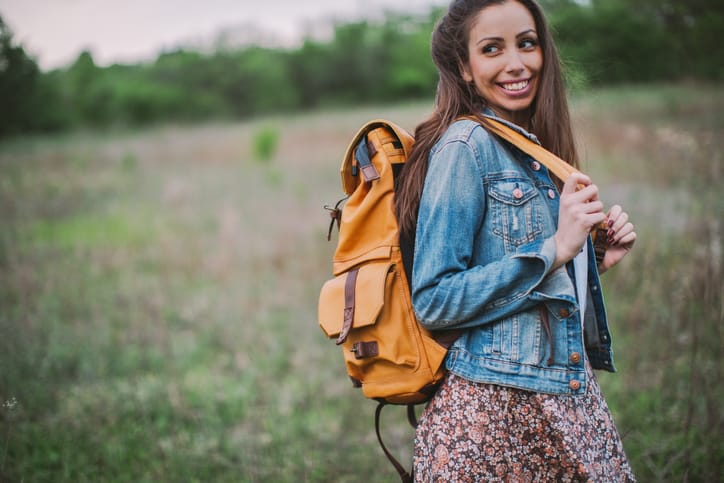 happy young woman hiking nature