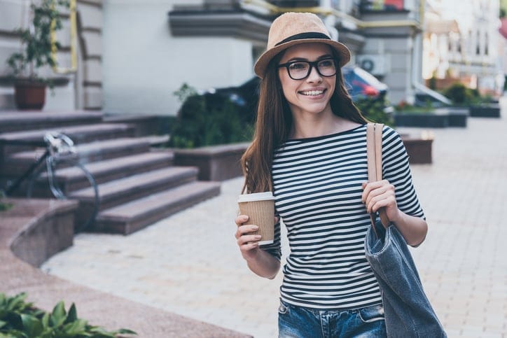 young woman hipster coffee walking city