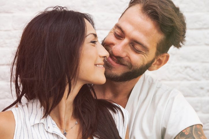 couple kissing close intimate romance
