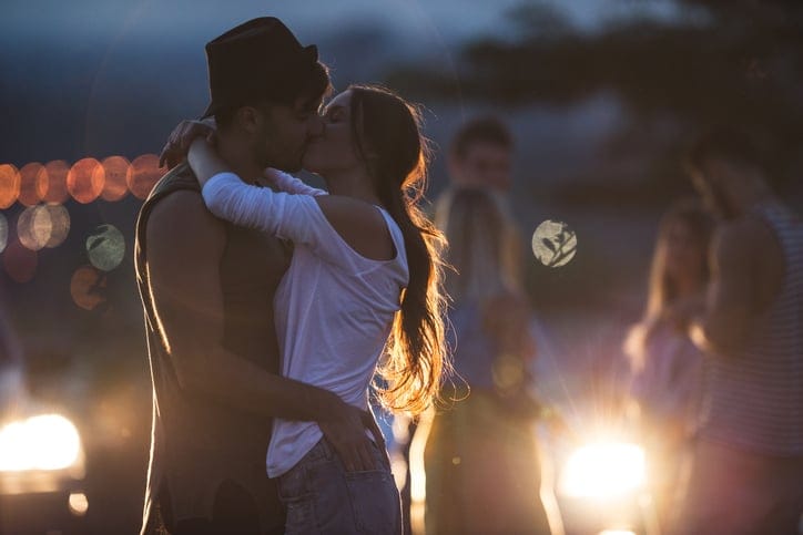 young couple kissing night romance