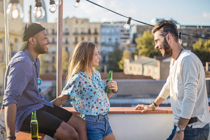Friends enjoying party on terrace during summer