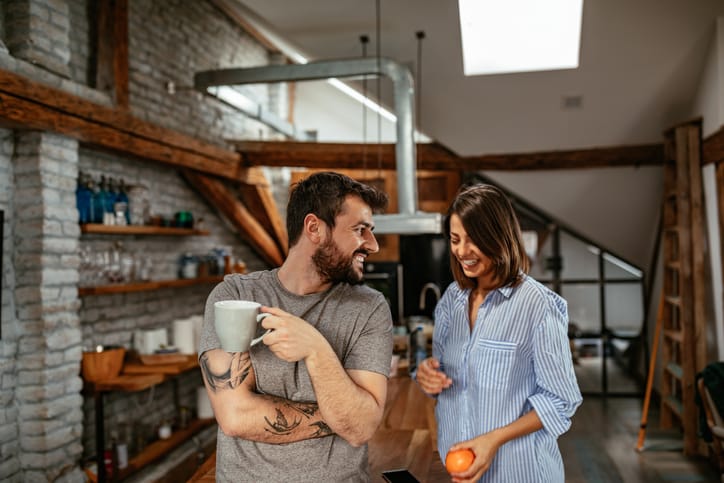 Woman and man having coffee.