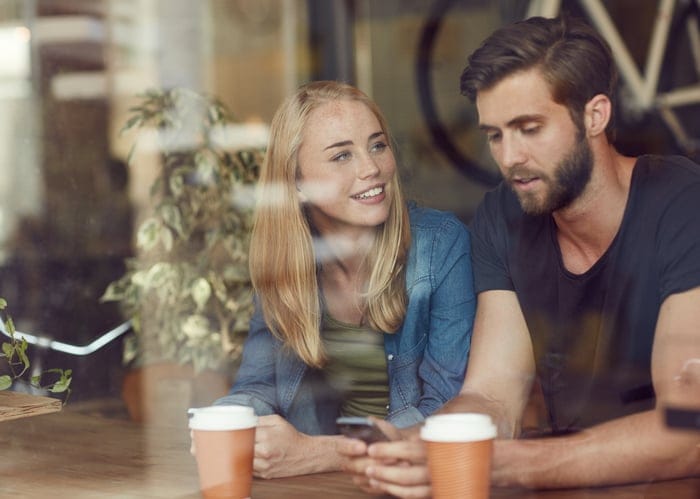 young happy couple cafe