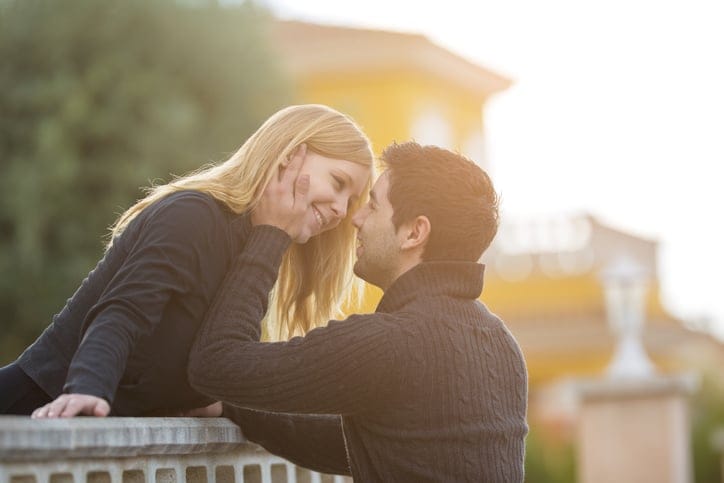 young couple at balcony in romance. Teenager in love