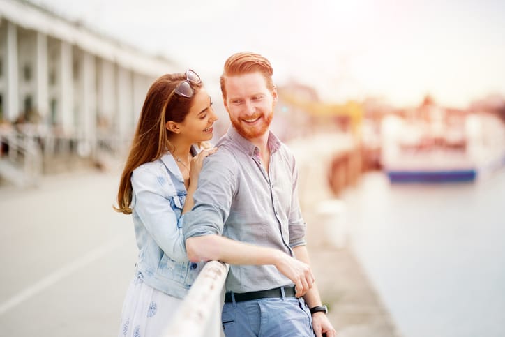 Couple in love sharing emotions in beautiful sunset