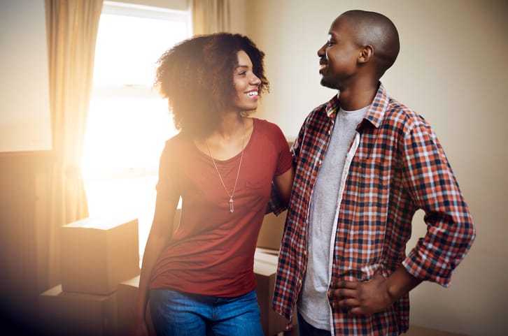 Cropped shot of a young couple moving into their new home