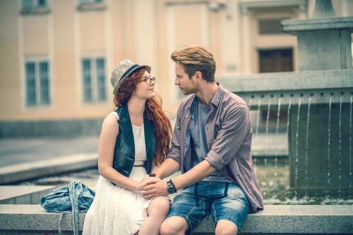 Romantic redhead couple enjoying in a day and talking to each other.