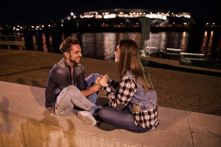 romantic couple on a wall