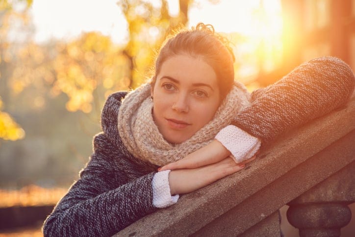 sunset woman sitting alone