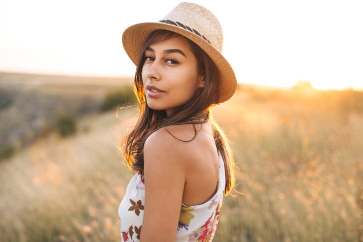 young woman portrait field fashion sun