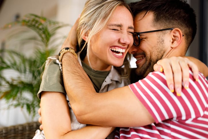 couple laughing and embracing