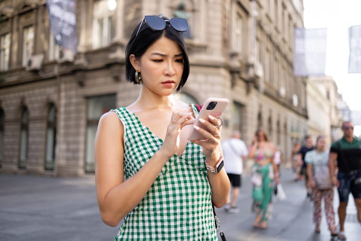 Woman texting on her phone.