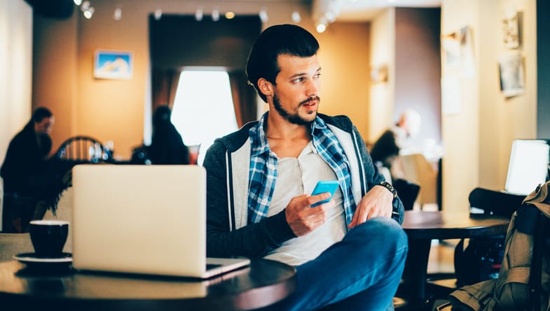 Man having a break in a coffee with a laptop.