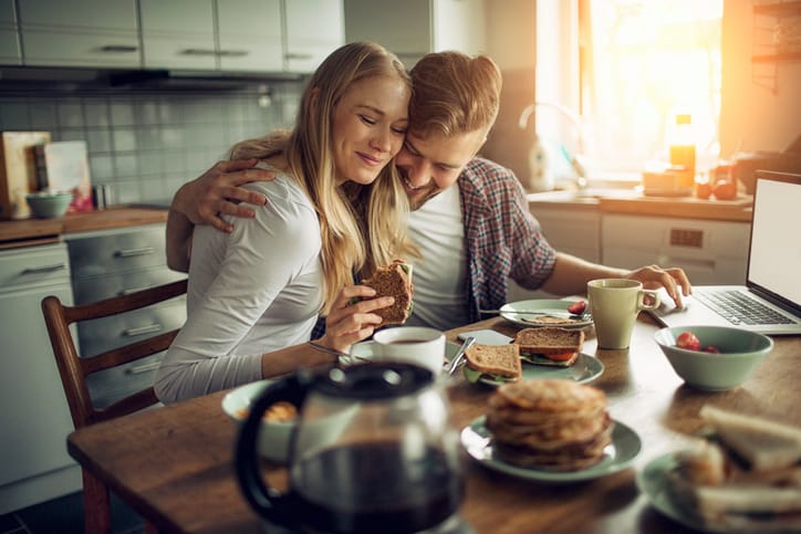 Couple enjoying breakfast together.