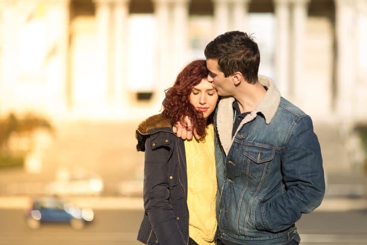 Photo of pretty young couple cuddling