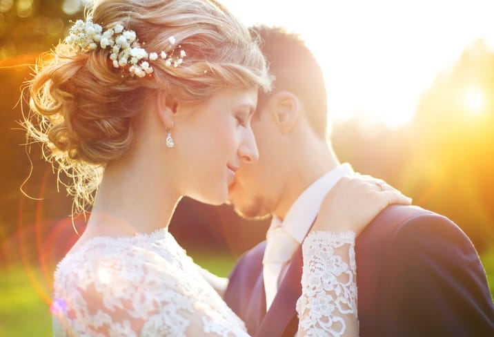 Young wedding couple enjoying romantic moment.