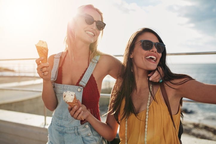 Two female friends enjoying ice cream together