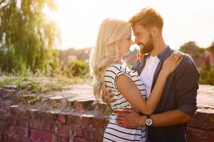 Man and woman embracing in the sunshine