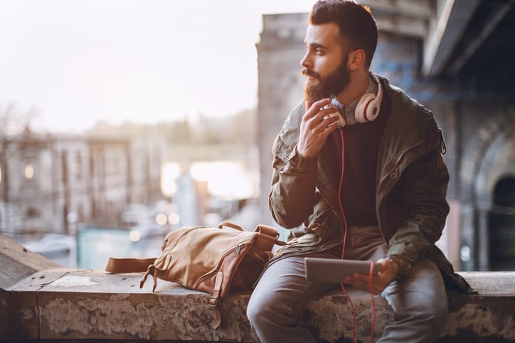 Man using digital tablet outdoors