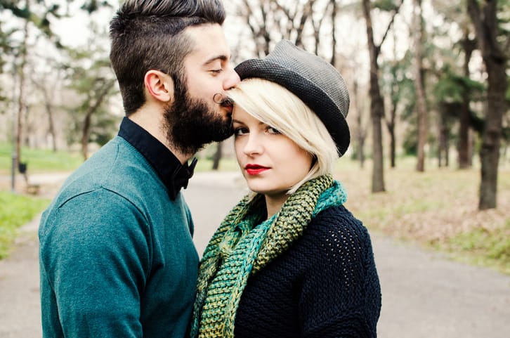 Hipster couple park kiss