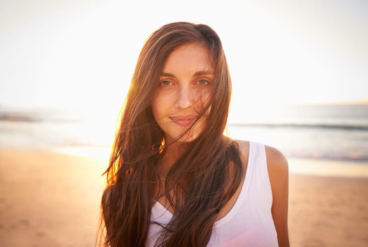 young woman beach happy portrait