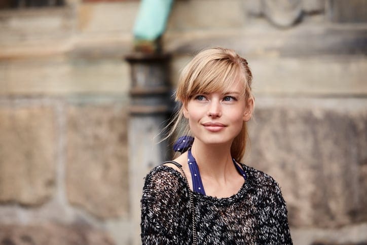 Beautiful young woman looking away