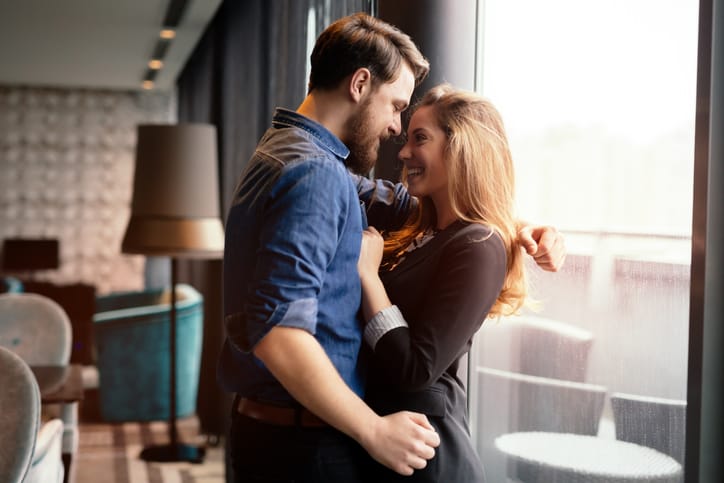 Romantic beautiful couple sharing genuine emotions and happiness