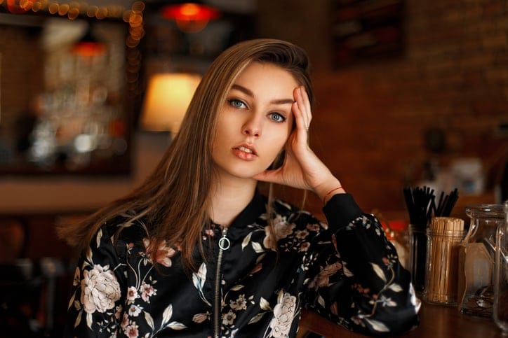 Beautiful young girl resting in a cafe