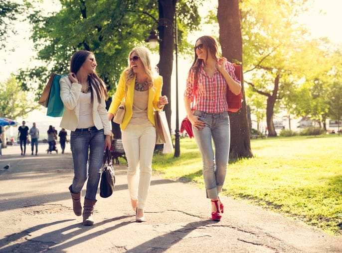 three women walking in the park