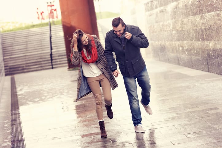 couple running rain romance