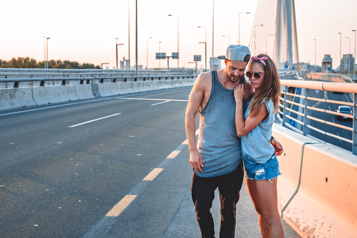 Couple in love standing on the street at the golden hour