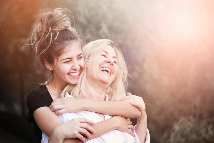 Smiling mother with young daughter