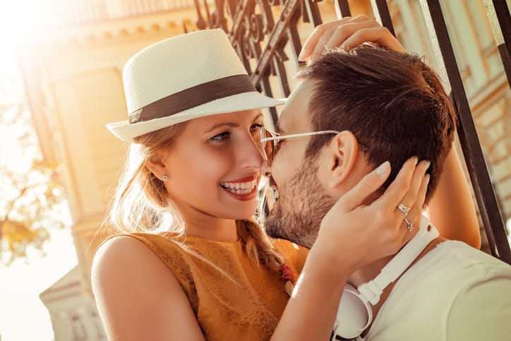 Image of a happy laughing couple in the city.