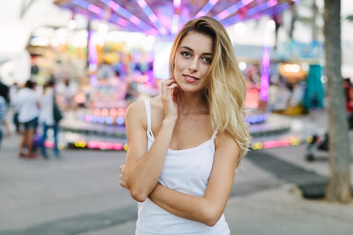 Beautiful woman looking at camera and smiling.