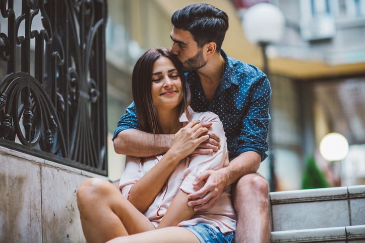 Young couple enjoying in their love at city.